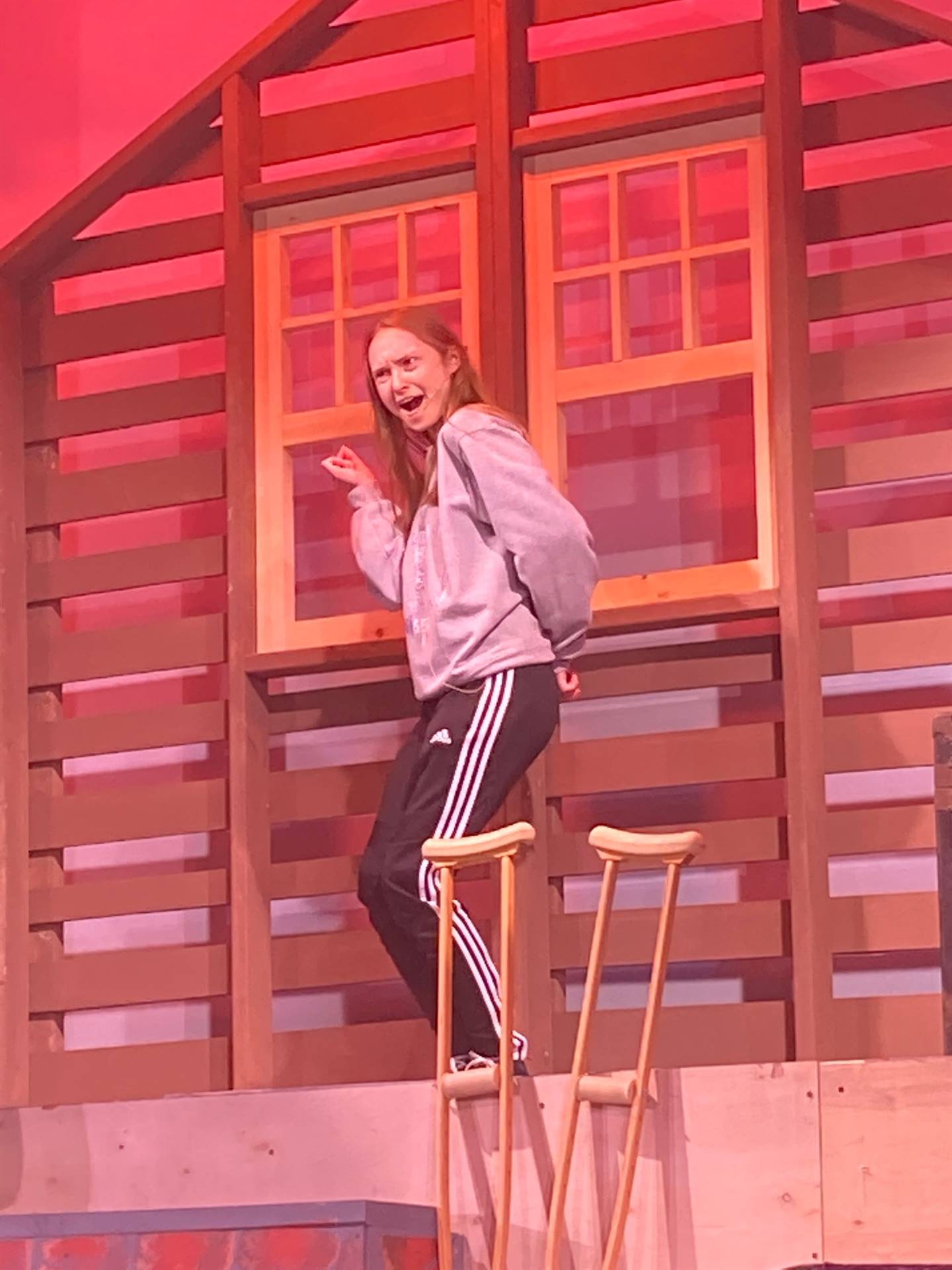 Girl at window during fall production rehearsal