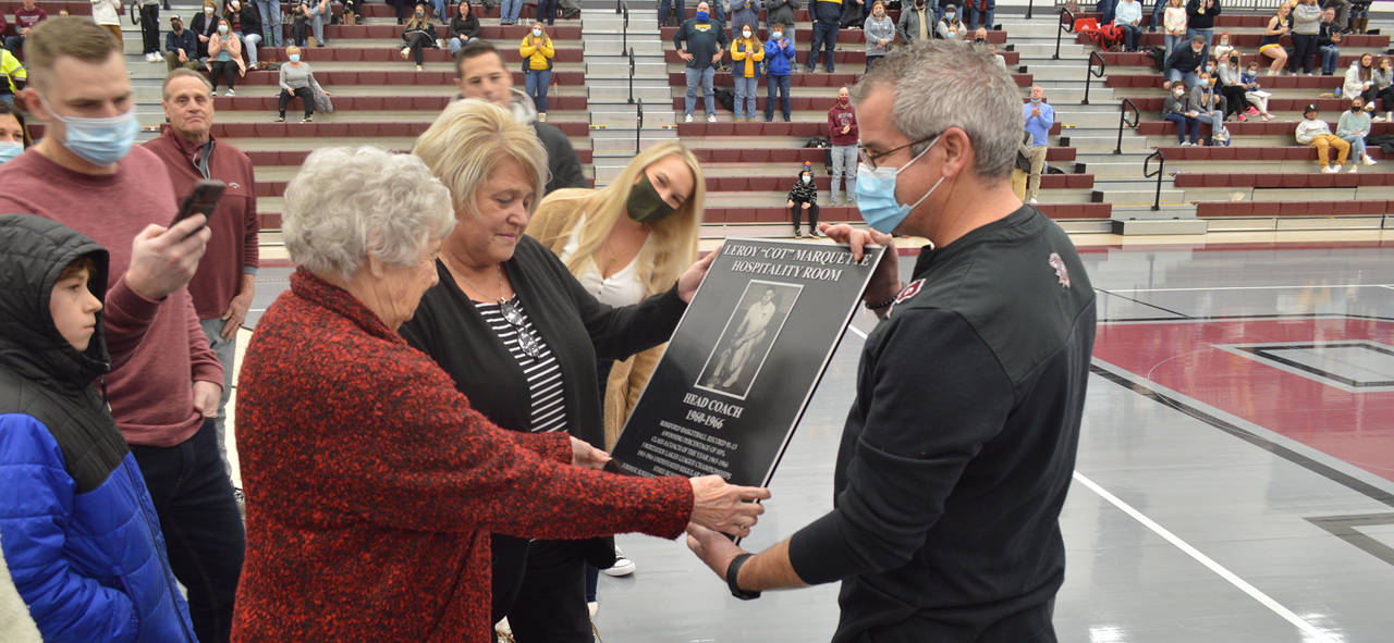 Marquette family receiving plaque.