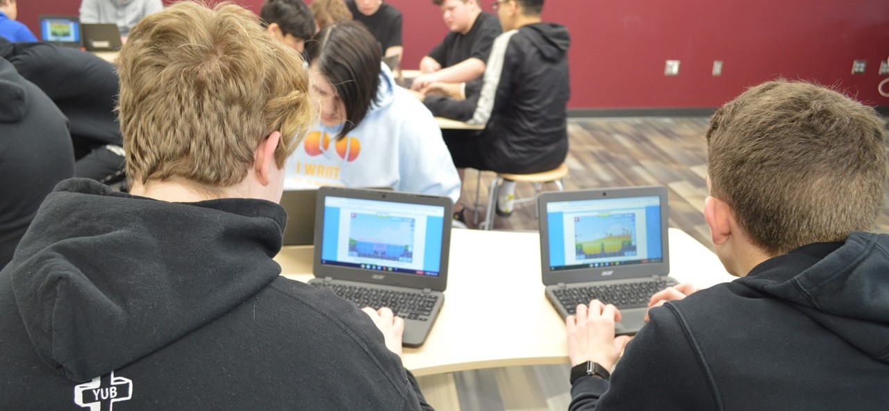 Students using computers in STEM.