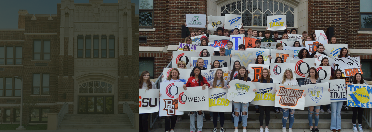 Photo of a past Decision Day with students holding posters of where they will further their educational or work career. 