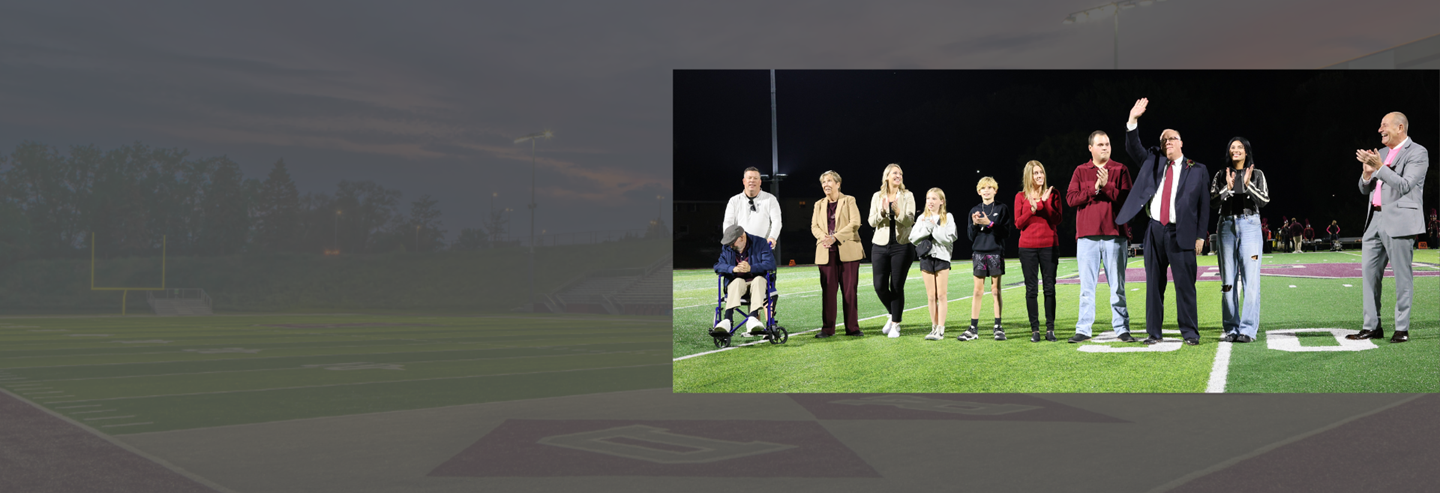 The 2024 Award of Distinction Ceremony on the football field with Mayor Neil MacKinnon, his family and Superintendent Dan Creps.